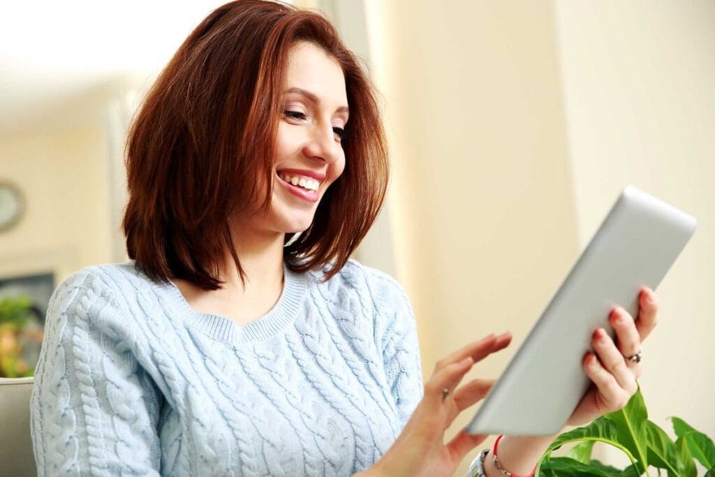 woman contacting Veracity Technologies on tablet
